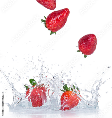 Fresh strawberries with water splashes.