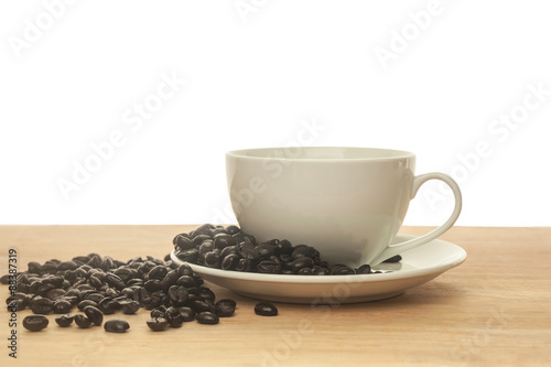 Fresh coffee in a white cup of coffee on wooden isolated