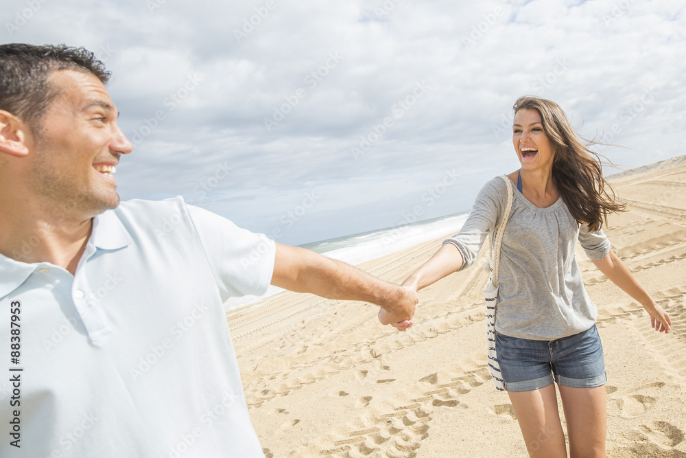 portrait of living young couple at the beach portrait of living young couple at the beach