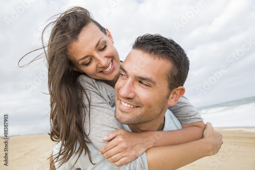 portrait of living young couple at the beach photo
