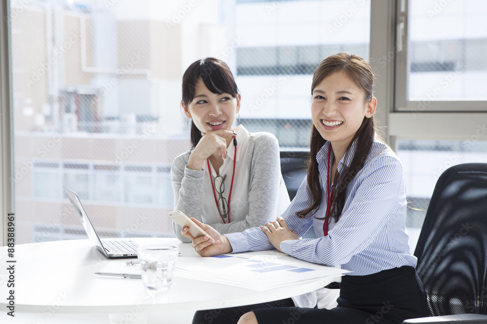 Women smile in the office Women smile in the office