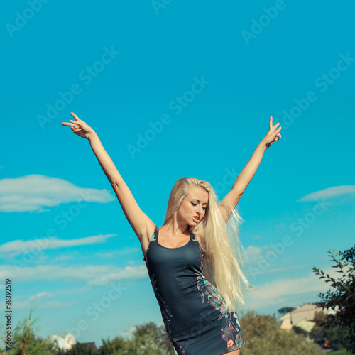 Portrait of emotional blonde bright outdoors. Woman enjoys life.