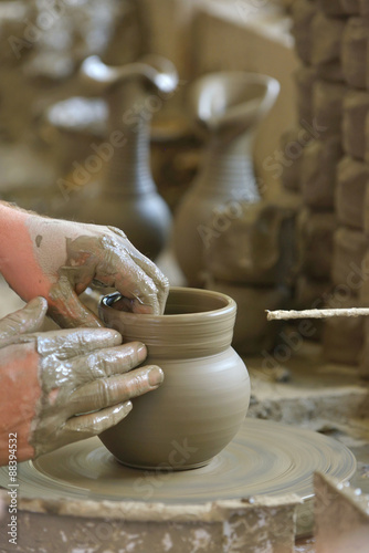 hands making clay pot © Laurentiu Iordache