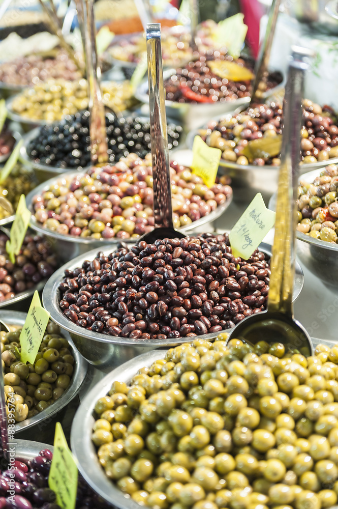Different marinated olives on street market
