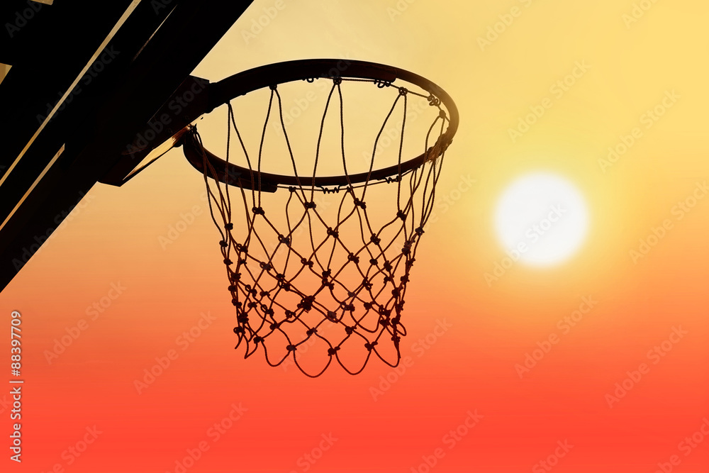 Basketball hoop outdoor in the sunset silhouette