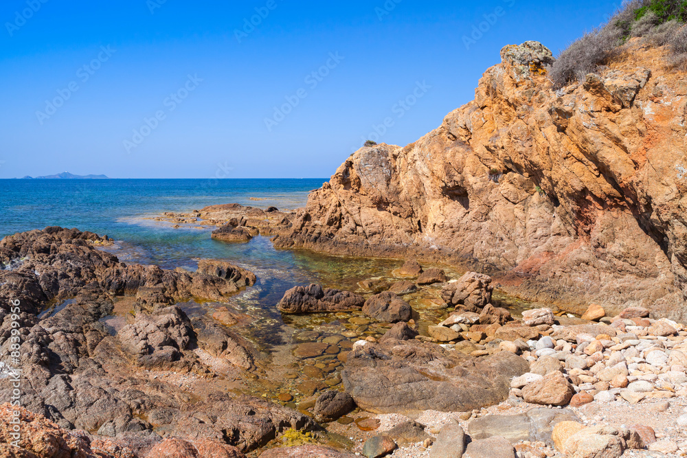 Coastal landscape with empty rocky wild beach