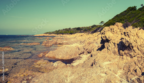 Coastal landscape with empty rocky wild beach © evannovostro