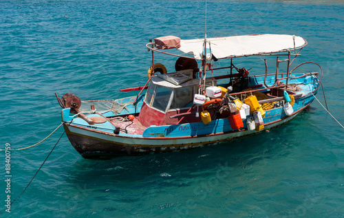 Fishing boat anchored in Matala bay, Crete
