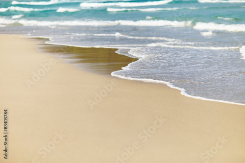 Sandy beach and wave