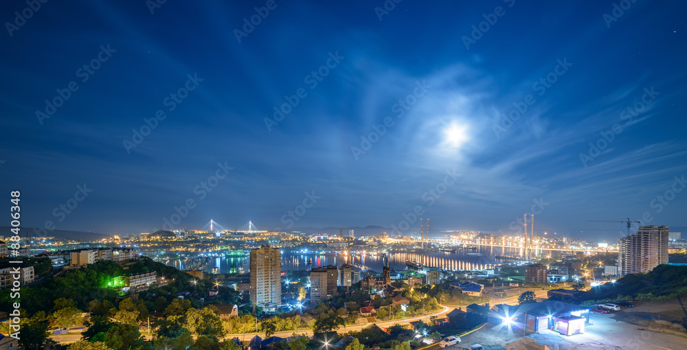 Vladivostok cityscape night view from south to west, panorama. Full moon.