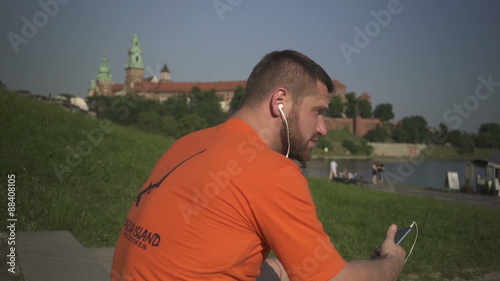 Man listining music on the phone.
 photo