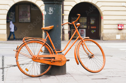 Orange bicycle on the street