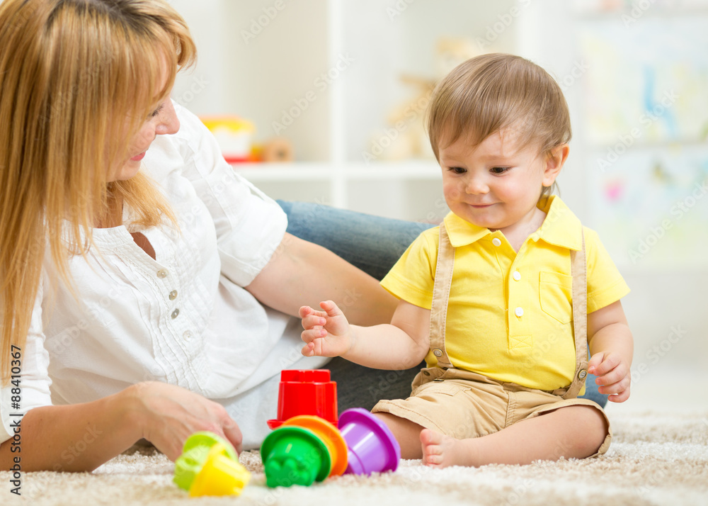 mother and kid playing block toys at home mother and kid playing block toys at home