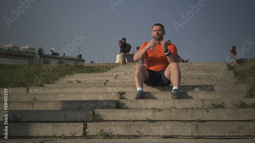 Man drinks water and goes running dowstairs.
 photo