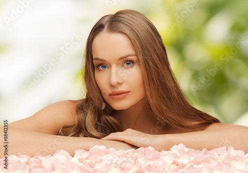 woman with rose petals and long hair