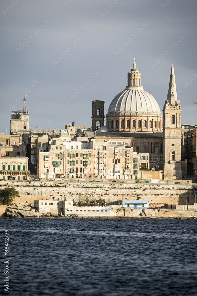 Valletta, Malta. A view over Marsamxett harbor of the skyline of the Maltese capital dominated by the dome of St. Paul's Anglican Cathedral.