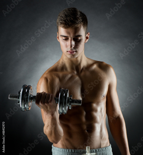 young man with dumbbell