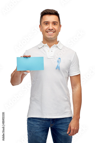 man with prostate cancer awareness ribbon and card © Syda Productions