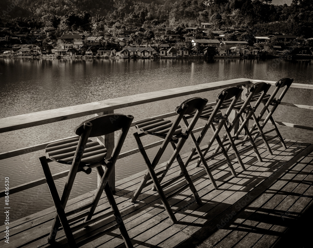 Fototapeta premium relax bamboo chairs on a beautiful lake