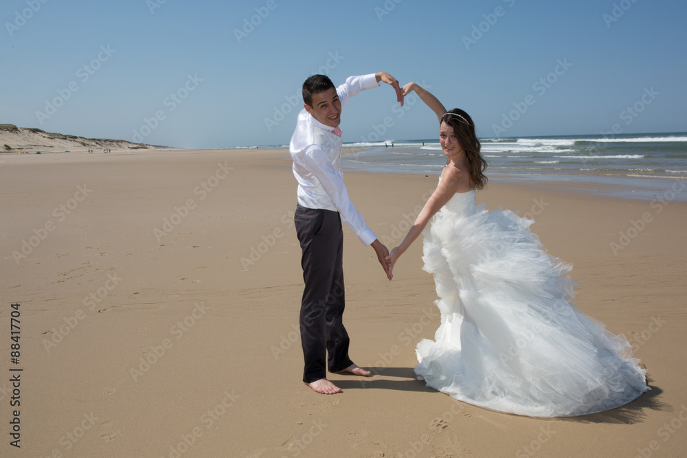 Beautiful couple at the beach happy together Beautiful couple at the beach happy together