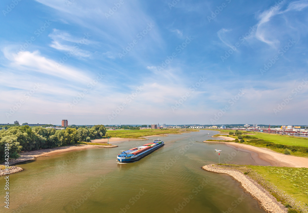 Obraz premium The Nederrijn river in front of the Dutch city of Arnhem