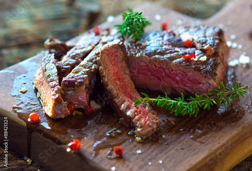 Fotografie Juicy Fillet Steak with Fresh Herbs