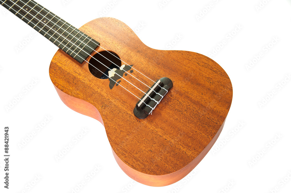 Close up of ukulele on white background