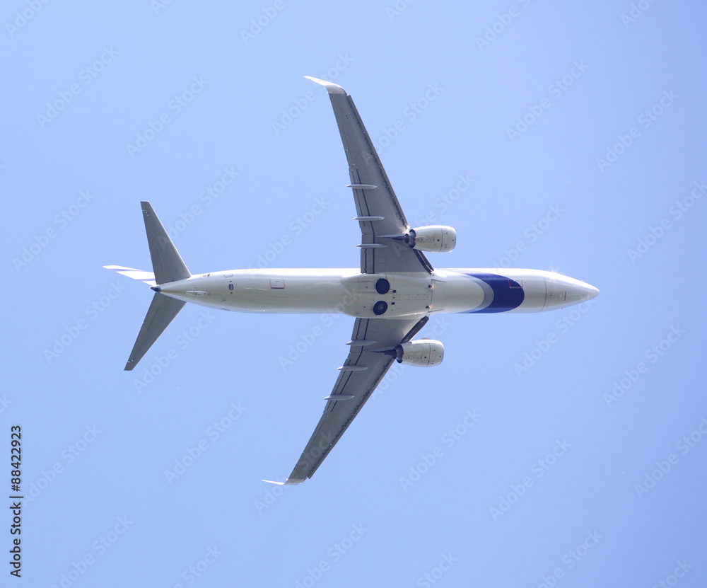 Large passenger plane flying high in the sky