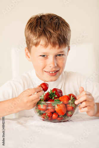 little boy with strawberry