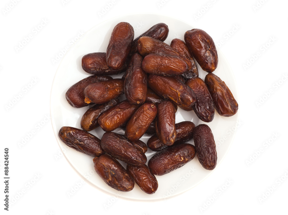 Fresh dates on white plate isolated on white background Fresh dates on white plate isolated on white background
