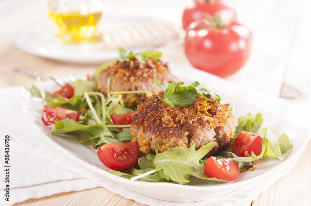 tasty chops with arugula and tomato 