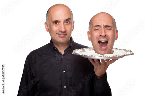 Man holding a head on a platter