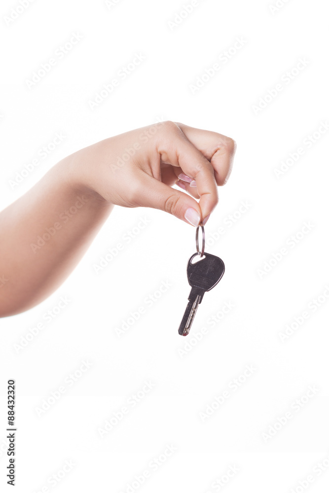 Hand with a key, isolated on white background Hand with a key, isolated on white background