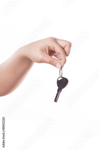 Hand with a key, isolated on white background