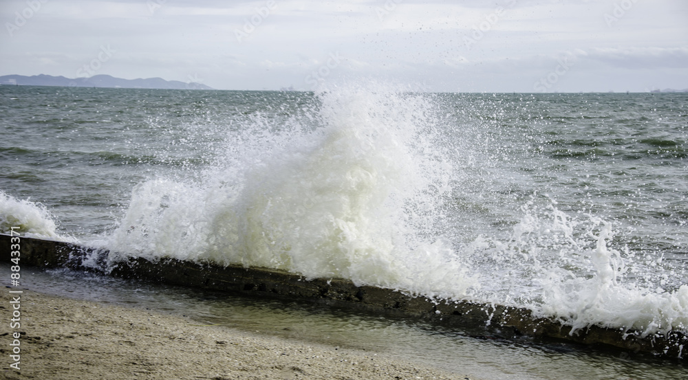 Fototapeta premium Splash of sea water beside beach