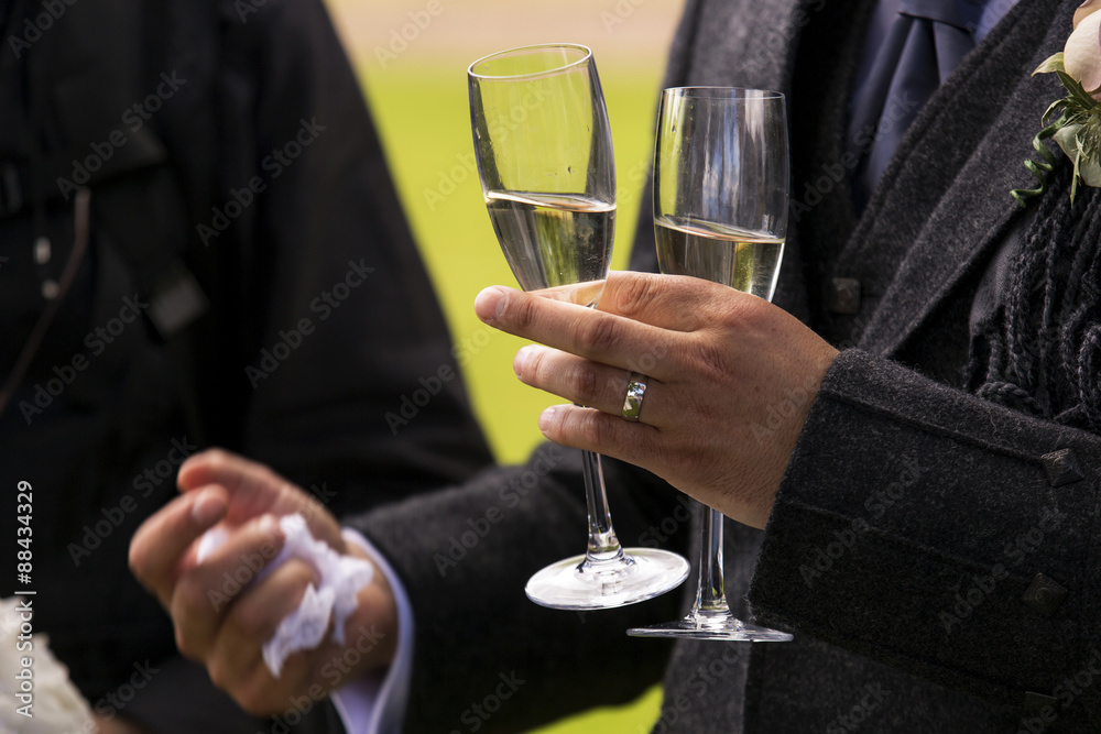 Man holding two champagne glasses Man holding two champagne glasses