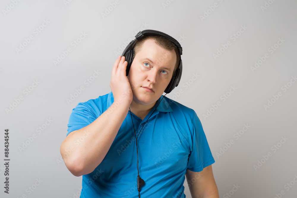 Fototapeta premium man listens music with headphones