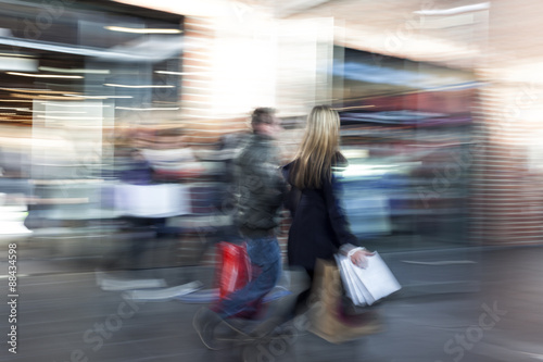 Intentional blurred image of young people in shopping center
