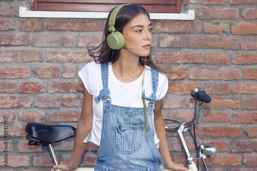 young beautiful woman enjoys music with headphones