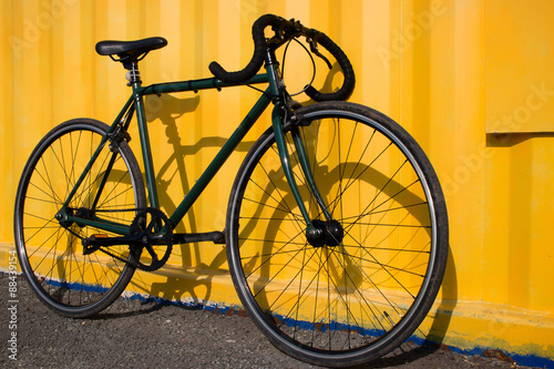 Green sport bike on a yellow background