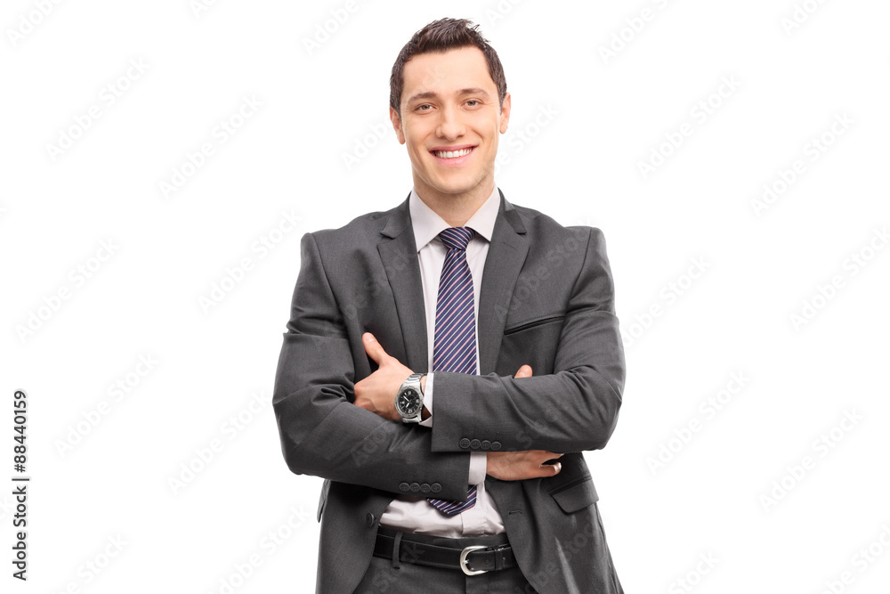 Confident young businessman in a gray suit looking at the camera Confident young businessman in a gray suit looking at the camera
