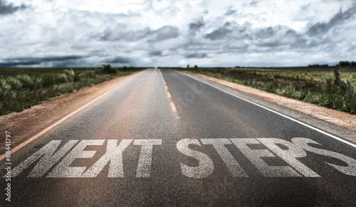 Next Steps written on rural road