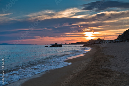 Waves on a sandy beach at sunset, west coast of Sithonia