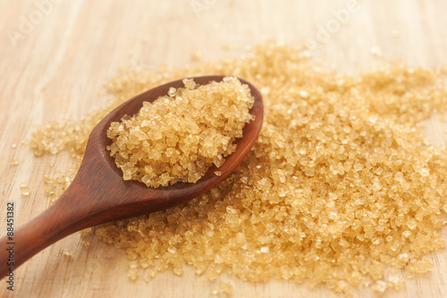 Sugar in a wooden spoon, Selective focus