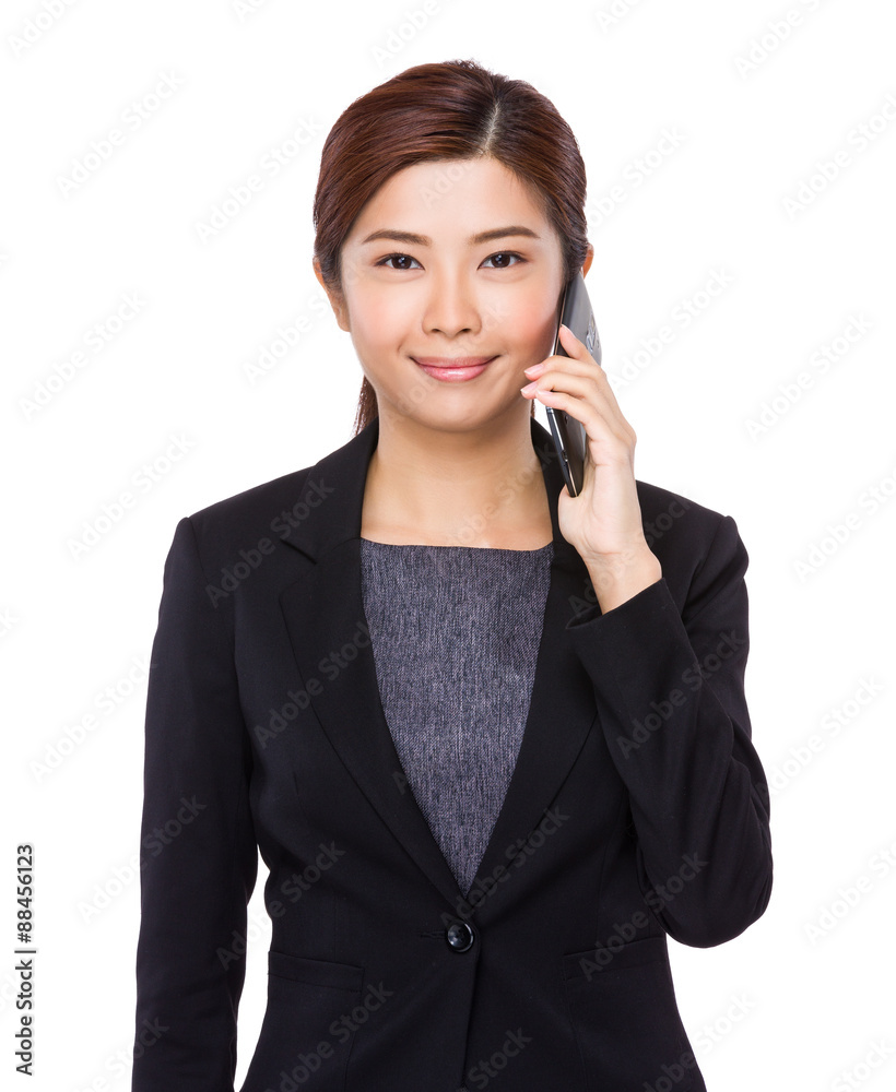 Asian businesswoman talk to mobile phone Asian businesswoman talk to mobile phone