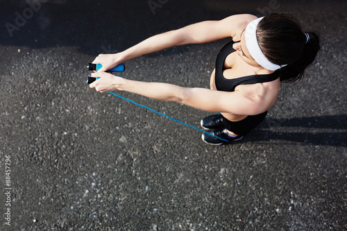 Sportswoman with skipping-rope