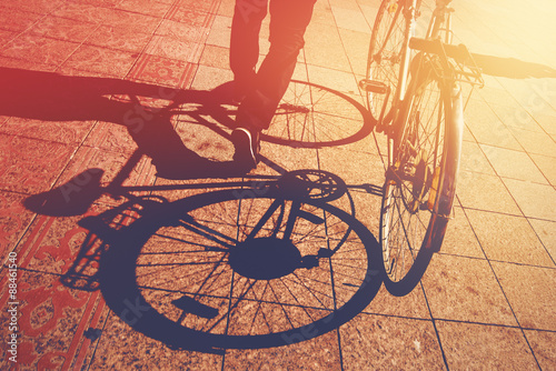 Shadow on Pavement, Man Pushing Bicycle photo