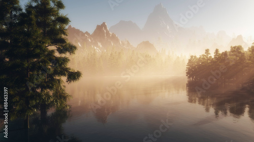 Lake with pines and mountains in background at sunrise