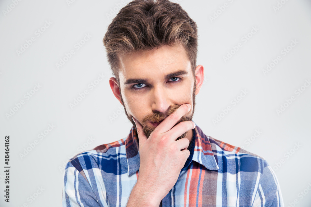 Portrait of a young pensive man looking at camera Portrait of a young pensive man looking at camera