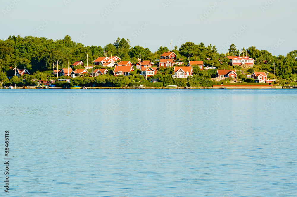 Red cabins by the water